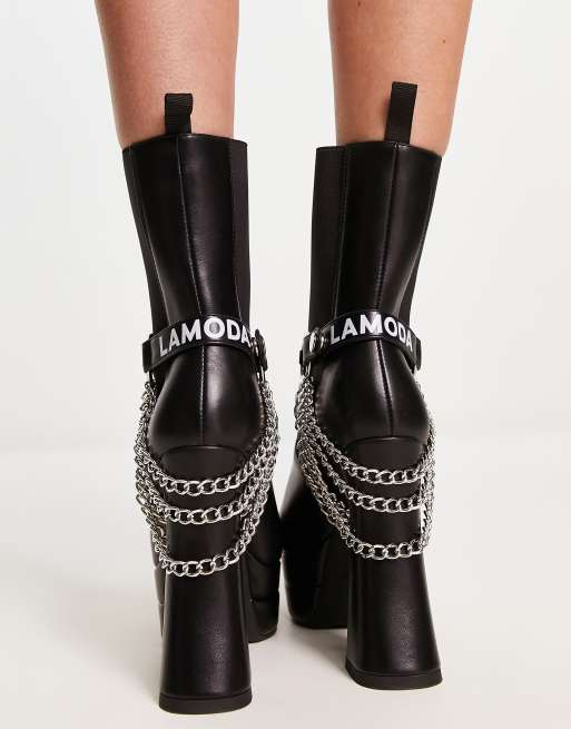 Boots with store chains and buckles