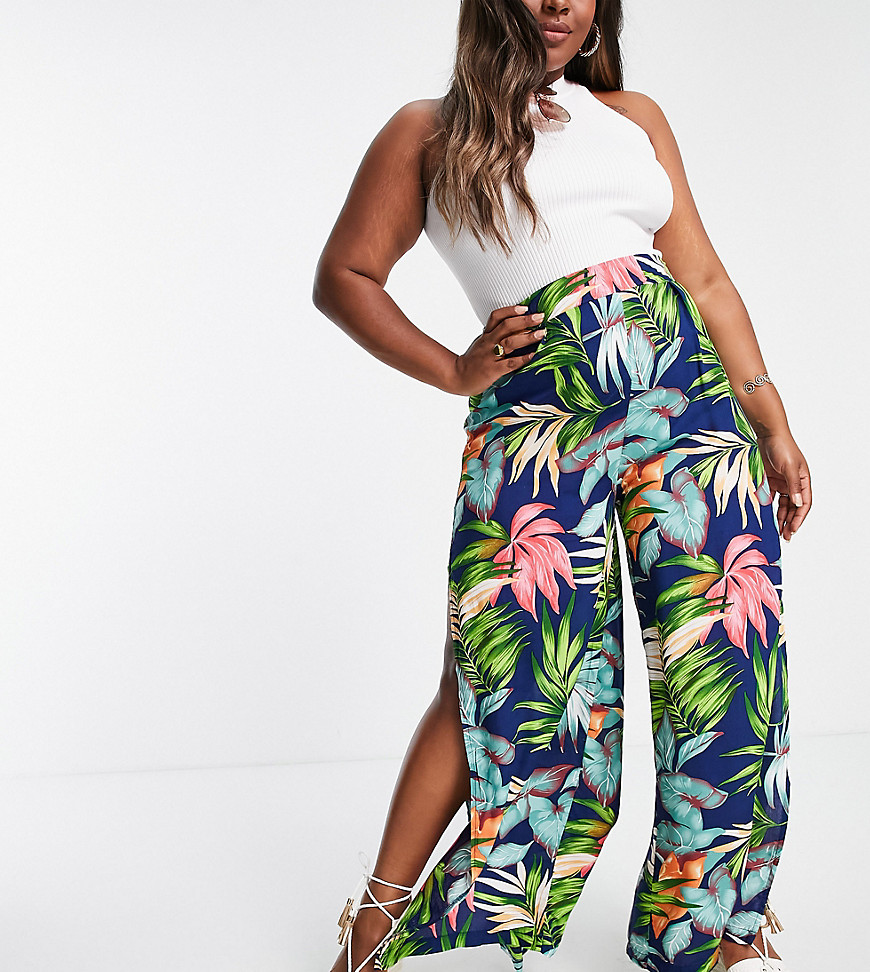 Plus-size trousers by Lasula These trousers are everything All-over tropical print High rise Stretch-back waist Side splits Wide leg