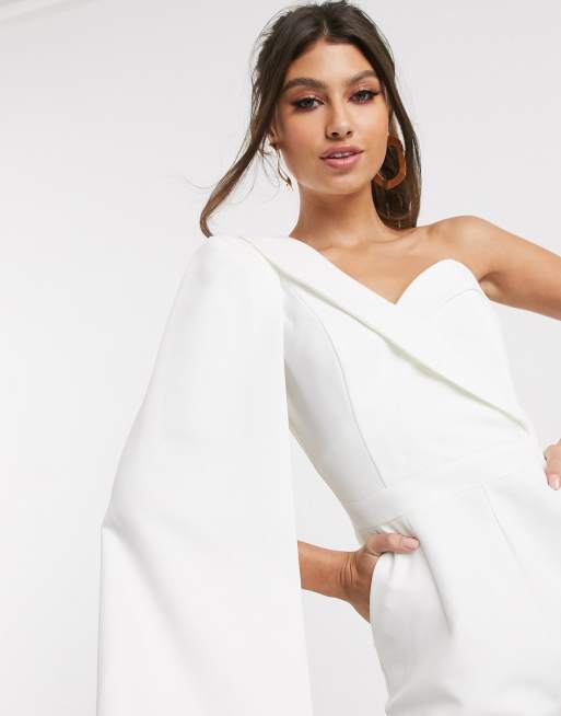 White jumpsuit store with cape