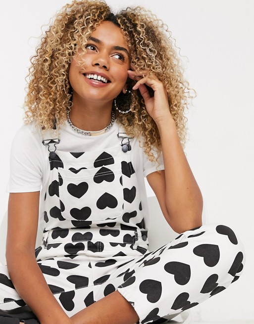 Lazy Oaf relaxed dungarees in all over heart print