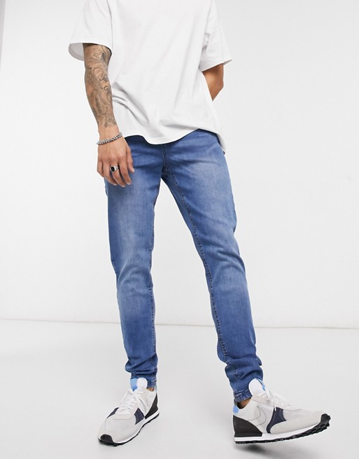 LDN DNM carrot fit jeans in mid washed blue