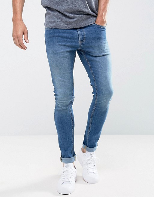 LDN DNM Super Skinny Spray on Stretch Jeans in Midwash Indigo | ASOS