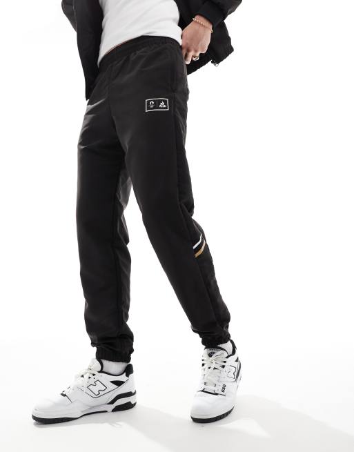 Le Coq Sportif Paris 2024 Olympics joggers in black ASOS