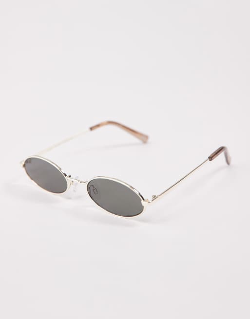 Le Specs – Love Train – Wąskie owalne okulary przeciwsłoneczne w złotym kolorze , 2 z 3