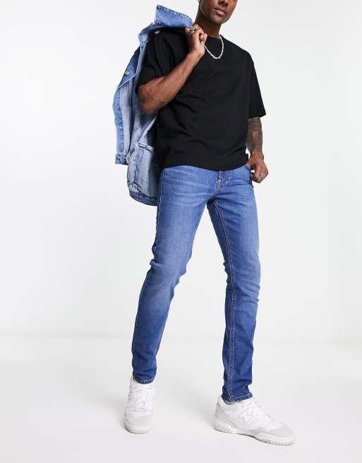 Lee – Luke – Jeans in Mittelblau mit schmalem Schnitt