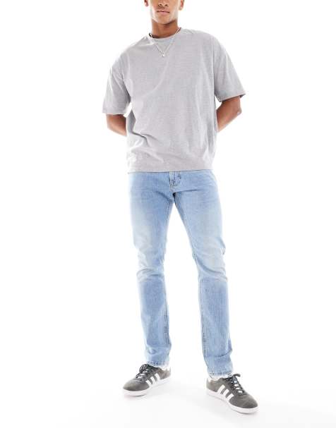 Lee – Luke – Ljusblå, tvättade, avsmalnande jeans med smal passform - view 1