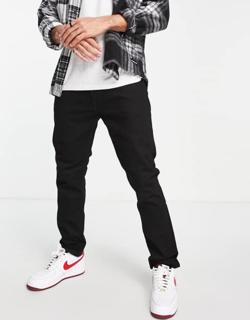 Lee – Luke – Schmal zulaufende Jeans mit schmalem Schnitt in Schwarz - BLACK