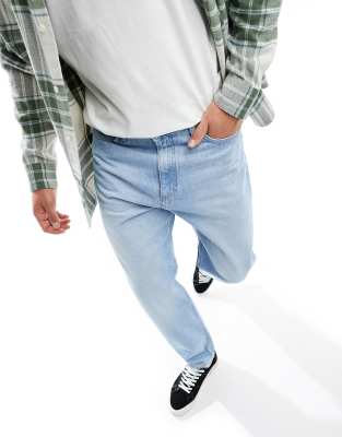 Lee Oscar relaxed tapered fit jeans in true light wash blue - ASOS Price Checker