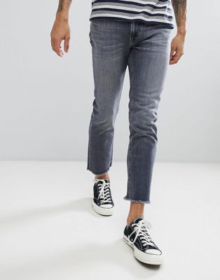 Lee – Skinny jeans med fransiga byxben-Grå