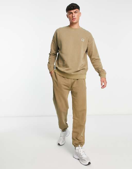 Lee tonal logo relaxed fit cuffed joggers in tan wash ASOS