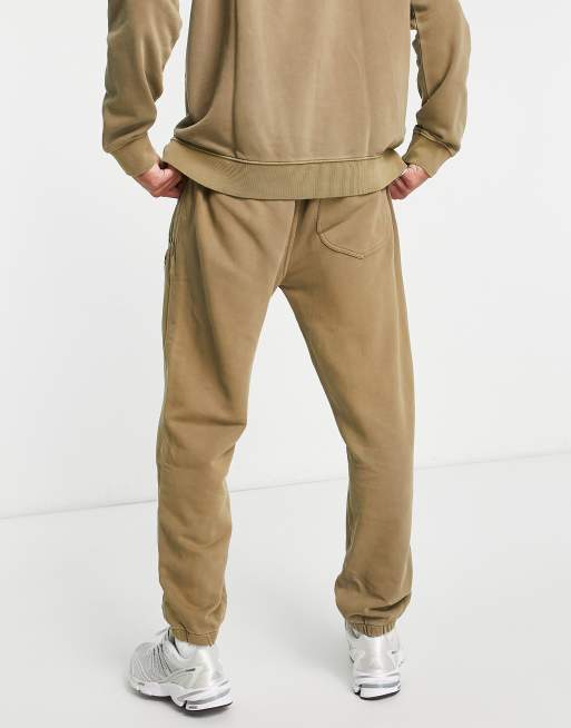 Lee tonal logo relaxed fit cuffed sweatpants in tan wash ASOS