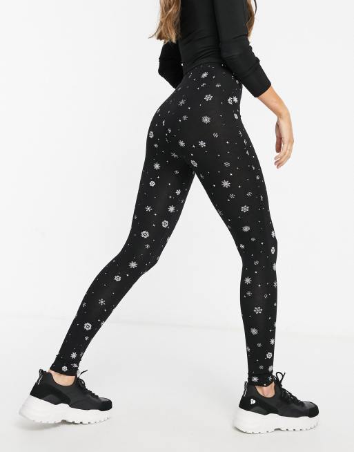 Leggings con estampado navideño copos de de ASOS | ASOS