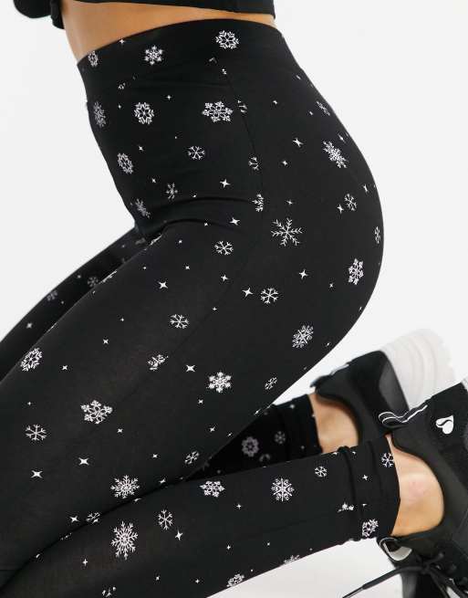 Leggings con estampado navideño copos de de ASOS | ASOS