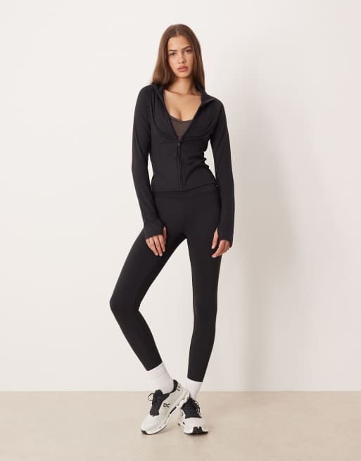 Leggings negro de talle alto para yoga con detalle fruncido de Gina Tricot (parte de un conjunto)
