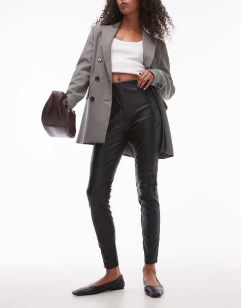 Leggings negros de corte slim con cinturilla elástica de cuero sintético de Mango - view 1