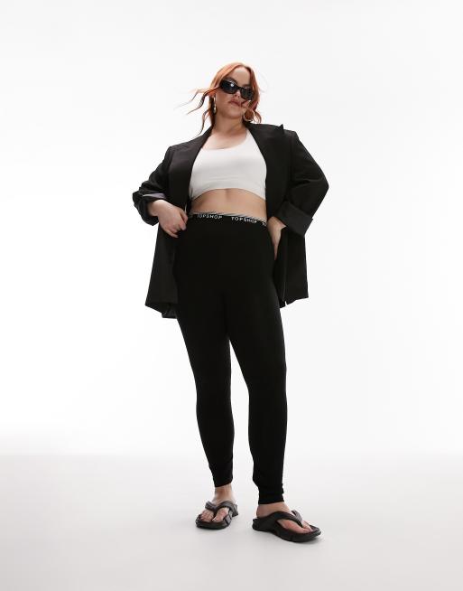 Leggings negros elásticos con detalle de la marca de Topshop Curve