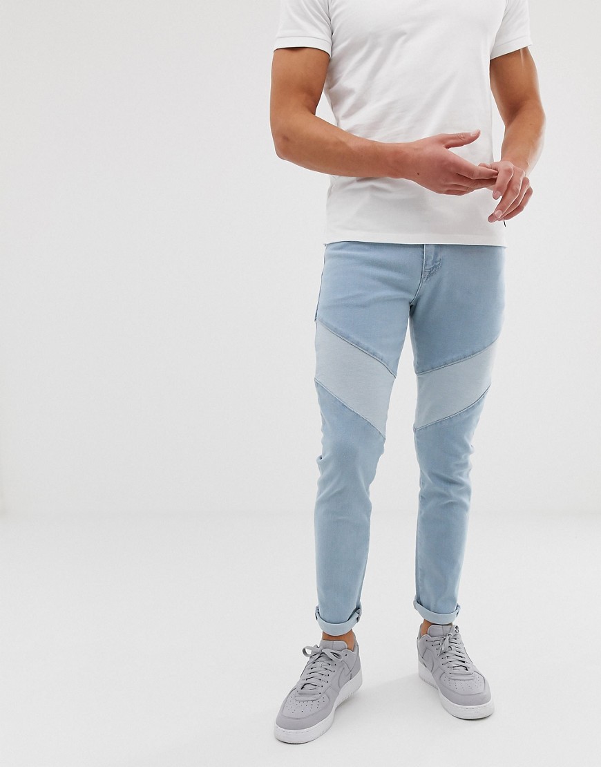 Let forvaskede blå skinny jeans med indsyede paneler fra ASOS DESIGN