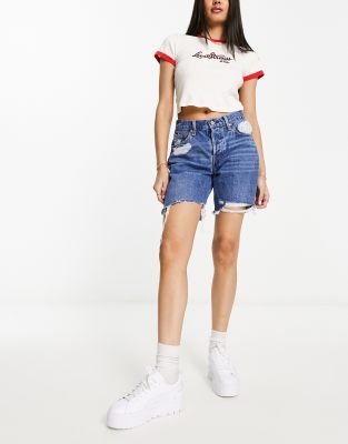 Levi's 501 mid thigh shorts in midwash blue