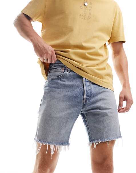 ASOS DESIGN shorter length denim shorts in 90s mid wash with rip