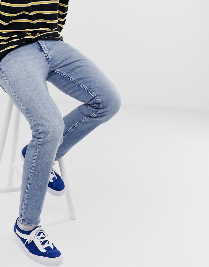 Levi's 501 slim tapered low rise jeans i revolution mid wash-Blå