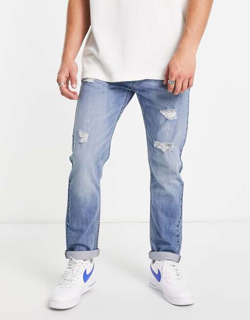 De slaapkamer schoonmaken cel teksten Levi's - 502 - Jeans met toelopende pasvorm in lichtblauw met distressing |  ASOS