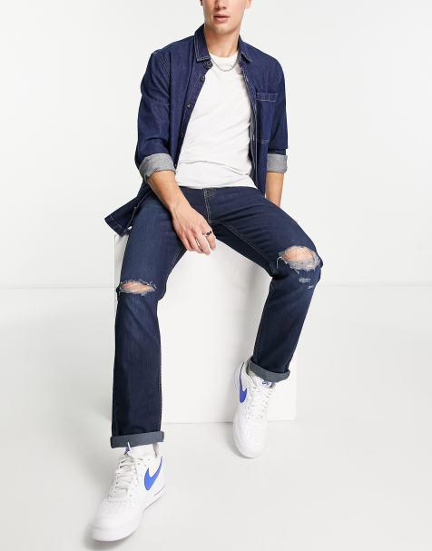 Levi's – 502 – Mörkblå, avsmalnande jeans med slitna detaljer - view 1