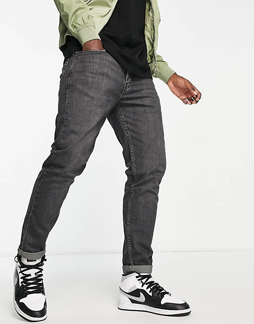 Levi's 502 tapered fit jeans in black wash | ASOS