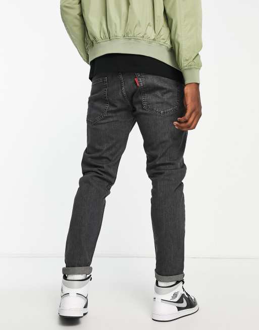 Levi s 502 tapered fit jeans in black wash ASOS