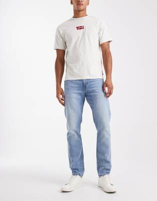 Levi's 502 Tapered Fit Jeans In White