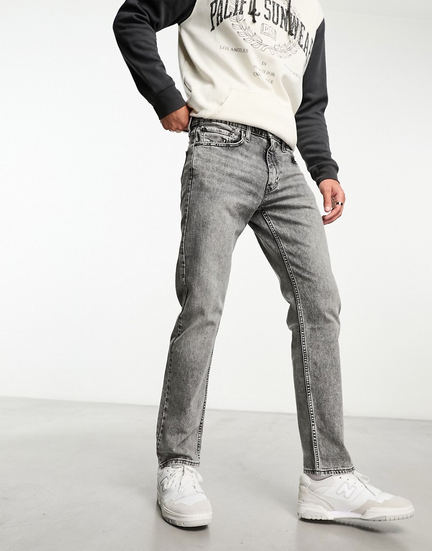 Levi’s 502 tapered fit jeans in light grey wash