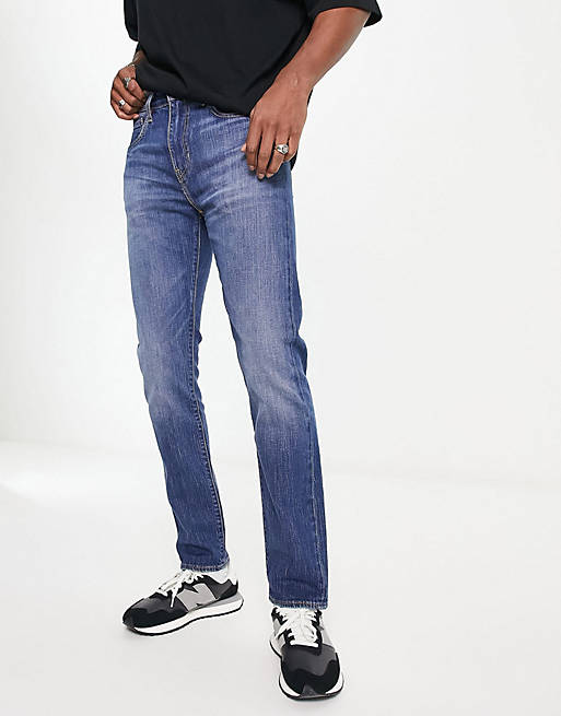 Levi's 502 tapered fit jeans in mid blue wash | ASOS