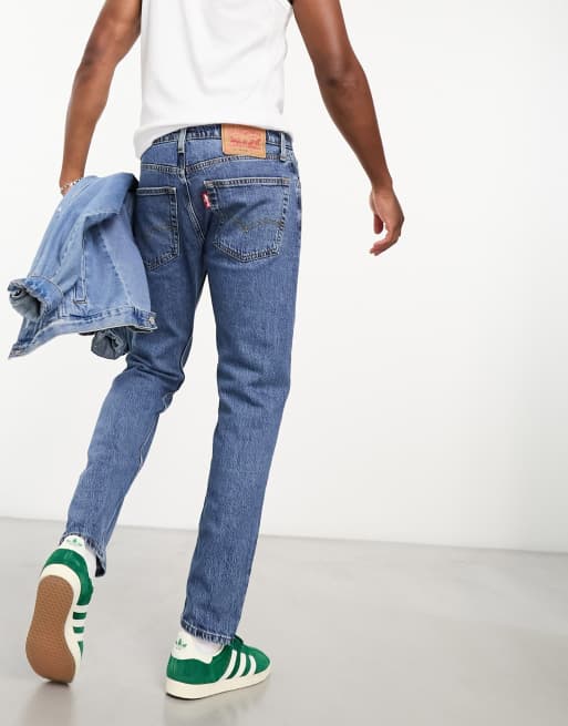 Levi s 502 tapered fit jeans in mid blue wash ASOS