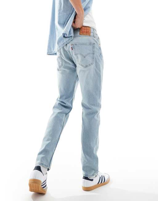 Levi s 502 tapered fit performance cool denim jeans in light blue ASOS