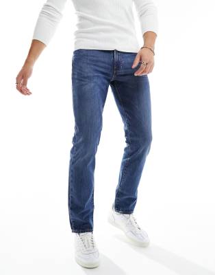 Levi's 511 slim fit jeans in mid blue - ASOS Price Checker