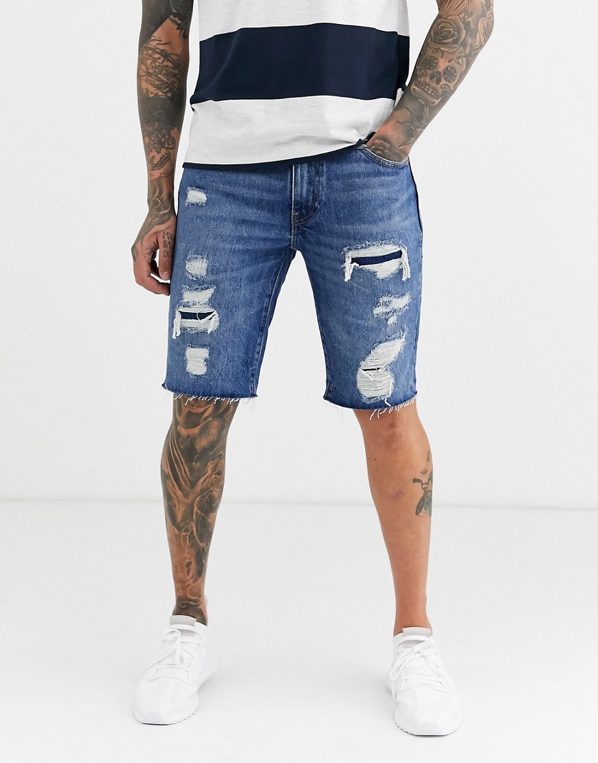 Levi's - 511 - Pantaloncini di jeans slim fit a vita bassa invecchiati con fondo a taglio vivo lavaggio vintage medio Hendersonville-Blu