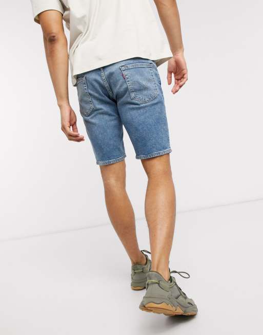 Levi s 511 slim fit hemmed denim shorts in baguette mid wash