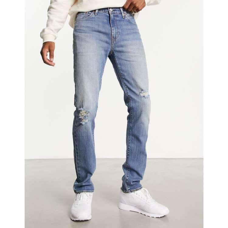 Levi 511 ripped jeans hotsell
