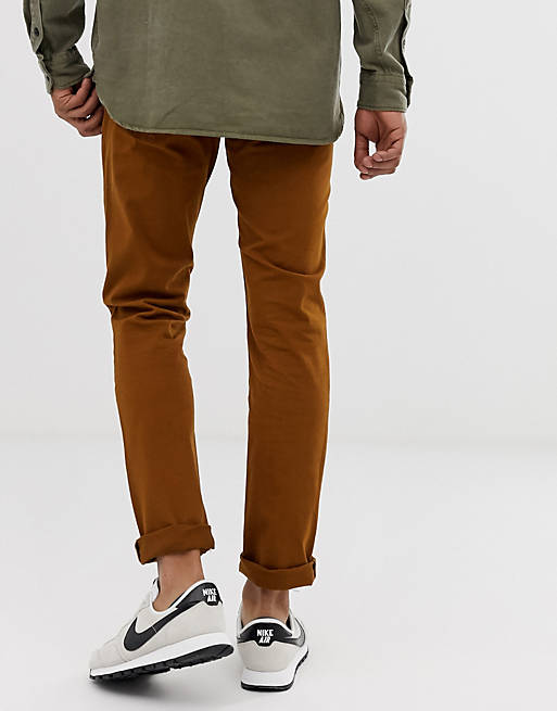 Levi's 511 slim fit low rise trousers in monk's robe tan | ASOS