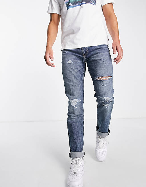 Levi's 511 slim jeans in blue wash with abrasions