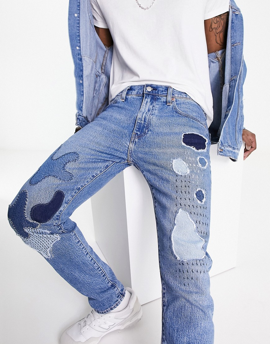 levi's - 512 - blå, smala och avsmalnande jeans med lapptäcksdesign och slitna detaljer