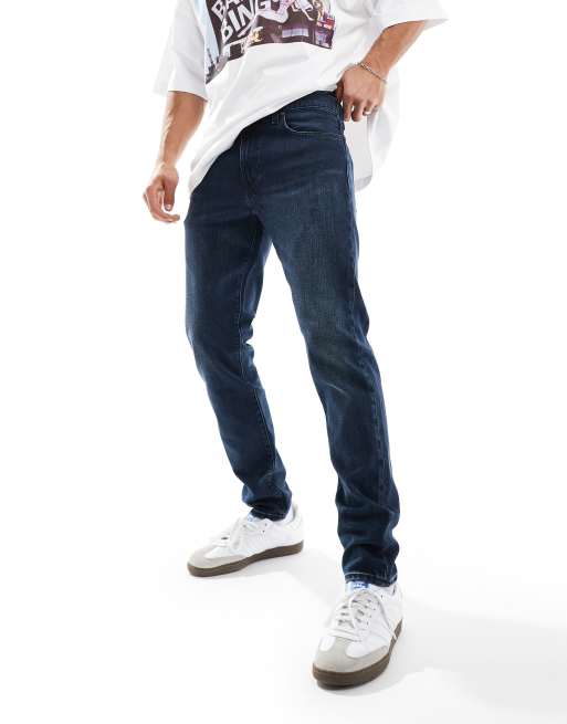 Levi's – 512 – Ciemnoniebieskie dopasowane jeansy ze zwężanymi nogawkami