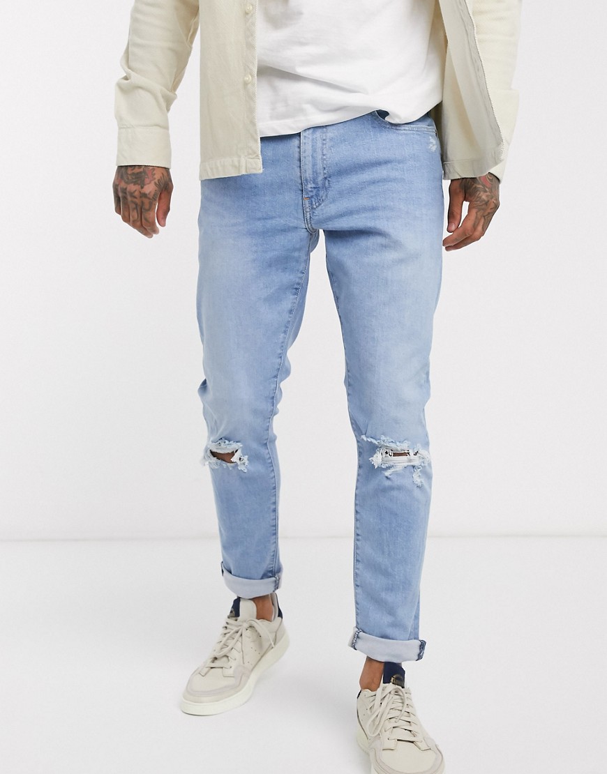 Levi's 512 - Distressed jeans met smaltoelopende pijpen en light wash-Blauw
