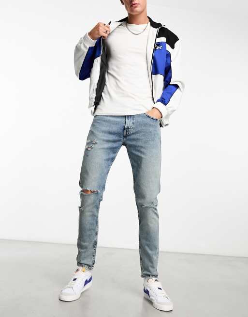 Levi's – 512 – Jasnoniebieskie dopasowane jeansy ze zwężanymi nogawkami i rozdarciami na kolanach