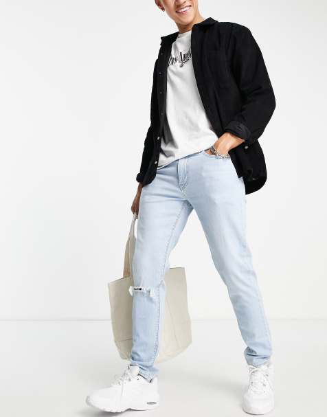 Levi's 512 – Schmal zulaufende Jeans in hellblauer Waschung mit schmalem Schnitt und Riss am Knie - view 1