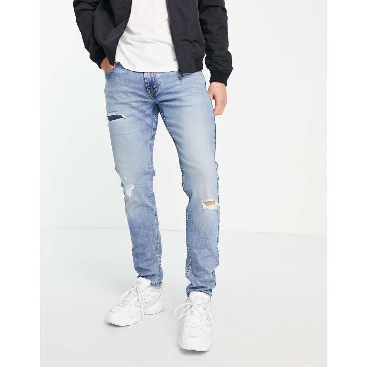 Levi's 512 slim taper jeans with distressing in light blue wash | ASOS