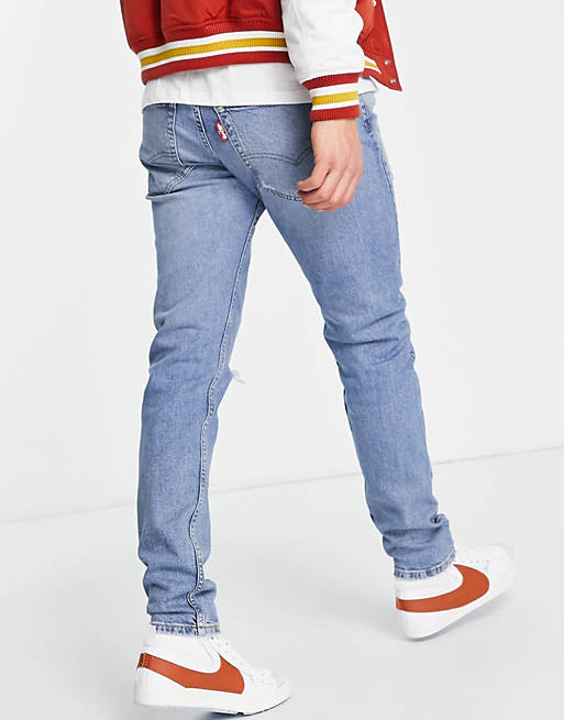 Levi's 512 slim taper lo ball jeans in light blue wash with rips | ASOS