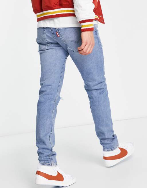 Levi's 512 slim taper lo ball jeans in light blue wash with rips