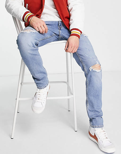 Levi's 512 slim taper lo ball jeans in light blue wash with rips | ASOS