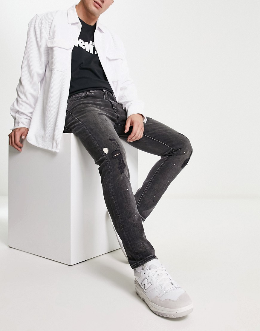 Levi's 512 slim tapered distressed jeans in black
