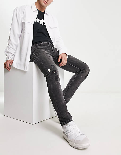 Levi's 512 slim tapered distressed jeans in black | ASOS